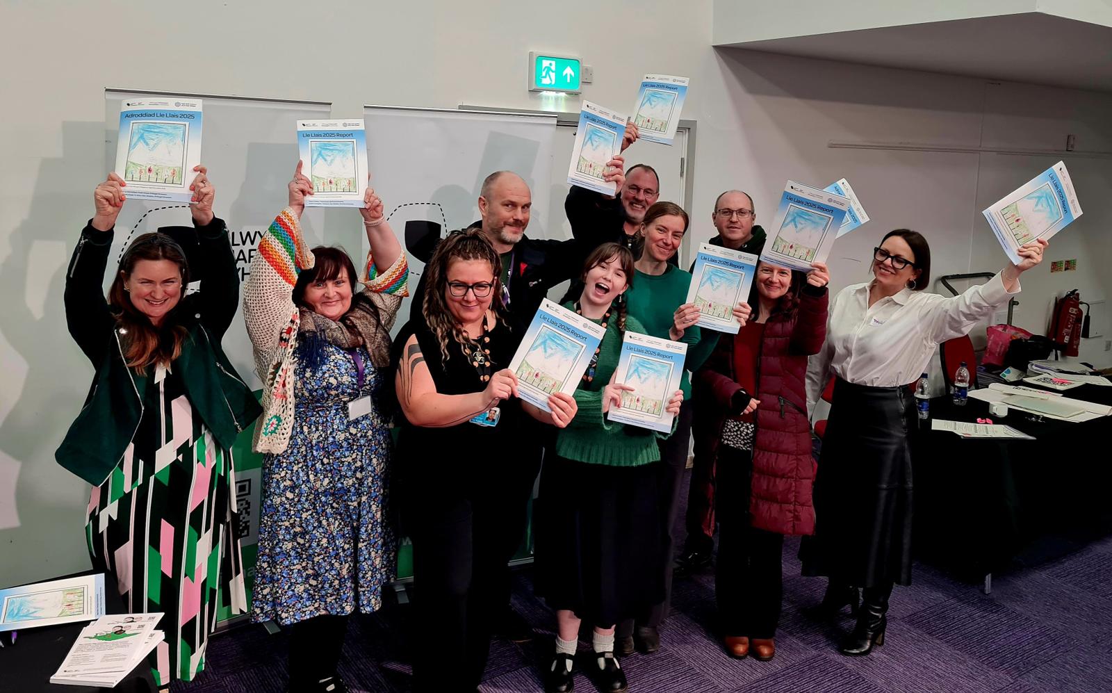 The team holding copies of the report